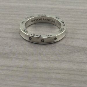 Tiffany & Co. Silver Ring with Modern Design and 3 Diamond Embellishments